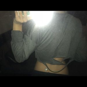 A charcoal grey long sleeve crop top